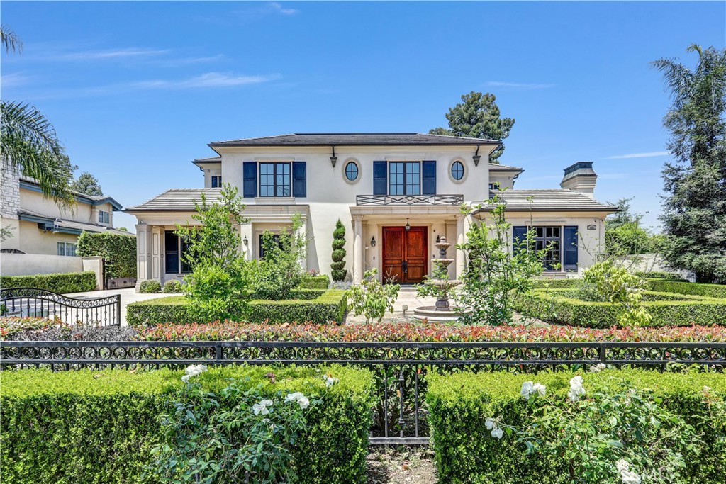 Exceptional custom-built south facing estate located in the heart of Arcadia’s prestigious "Baldwin Stocker" neighborhood! This elegant residence offers an 8300 sq ft of luxurious living space on a gated, beautifully landscaped lot. Featuring 5 spacious en-suite, this home combines quality craftsmanship with modern glamor. The grand foyer opens to formal living and dining rooms with a 2-story high ceiling and detailed finishes. The gourmet kitchen is equipped with top-of-the-line Viking appliances, huge center island, walk-in pantry, and a separate wok kitchen. The open family room, private office/library, and dedicated home theater provide ample space for relaxation and entertaining.
The luxurious primary suite offers a serene retreat with a spa-inspired bath, dual walk-in closets, private wet bar and peaceful mountain views. A main-floor guest suite adds flexibility for multi-generational living. Other highlights include an elevator, central vacuum system, smart home pre-wiring, and custom cabinetry throughout. The backyard is a true entertainer’s dream with a sparkling pool and spa, newly built putting green and lush gardens. A detached guest house and 4-car garage complete this exceptional home. Located within the award-winning Arcadia Unified School District and close to schools, parks, and shopping. A rare opportunity not to be missed!