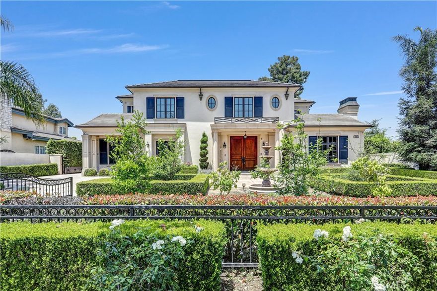Exceptional custom-built south facing estate located in the heart of Arcadia’s prestigious "Baldwin Stocker" neighborhood! This elegant residence offers an 8300 sq ft of luxurious living space on a gated, beautifully landscaped lot. Featuring 5 spacious en-suite, this home combines quality craftsmanship with modern glamor. The grand foyer opens to formal living and dining rooms with a 2-story high ceiling and detailed finishes. The gourmet kitchen is equipped with top-of-the-line Viking appliances, huge center island, walk-in pantry, and a separate wok kitchen. The open family room, private office/library, and dedicated home theater provide ample space for relaxation and entertaining.
The luxurious primary suite offers a serene retreat with a spa-inspired bath, dual walk-in closets, private wet bar and peaceful mountain views. A main-floor guest suite adds flexibility for multi-generational living. Other highlights include an elevator, central vacuum system, smart home pre-wiring, and custom cabinetry throughout. The backyard is a true entertainer’s dream with a sparkling pool and spa, newly built putting green and lush gardens. A detached guest house and 4-car garage complete this exceptional home. Located within the award-winning Arcadia Unified School District and close to schools, parks, and shopping. A rare opportunity not to be missed!