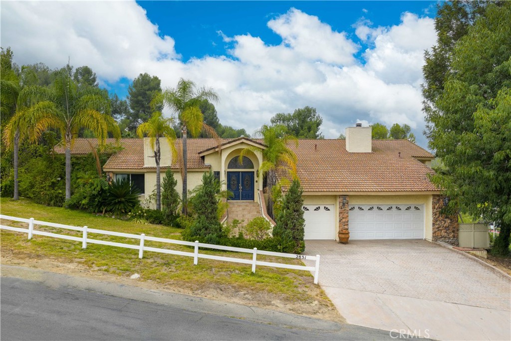Experience luxury living in the highly sought-after, 24-hour guard-gated community of The Country. This stunning home features 4 spacious bedrooms, an office, a versatile loft, and 4 bathrooms, all thoughtfully designed to provide both comfort and functionality. Situated on an expansive lot with room to expand and stunning views, this property offers elegance with endless possibilities.
Step through the impressive double-door entry into a bright and welcoming foyer, highlighted by marble flooring and a striking chandelier. The open living room provides the perfect space for relaxing or entertaining guests. Just a few steps up, you’ll find the formal dining room with its elegant chandelier, leading into the kitchen. The adjacent breakfast nook and family room create a seamless flow, featuring another beautiful marble fireplace and sliding doors that open to a balcony with breathtaking mountain and city light views.
The main level includes a luxurious primary suite for added comfort and privacy. Downstairs, you’ll find additional bedrooms and a full bathroom, along with direct access to a second balcony — perfect for enjoying Southern California’s beautiful weather.
With recessed ceilings, fresh paint, and abundant natural light throughout, this home offers a warm and inviting atmosphere.
Don’t miss your chance to own a piece of this exclusive community — schedule a private showing today!