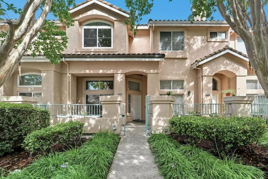 Welcome to the pinnacle of luxury living in this upgraded townhouse, ideally located in Fremonts highly sought-after Ardenwood neighborhood with access to top-rated schools. The gated front entry opens to a serene patio, leading into a bright, soaring-ceiling living space featuring gleaming hardwood floors and a cozy marble-accented fireplace. A formal dining area flows effortlessly into the eat-in kitchen perfect for everyday family meals or entertaining guests. The kitchen boasts new quartz countertops and opens to a private balcony, ideal for morning coffee or relaxing evenings under the sky. Upstairs, discover three generously sized bedrooms, enhanced with hardwood flooring and double-pane windows. The primary suite impresses with a vaulted ceiling, walk-in closet, and a spa-like ensuite bathroom with dual sinks offering a true retreat. As part of the desirable Capriana community, residents enjoy a sparkling pool and spa, all with low HOA dues. The prime location offers unmatched convenience walking distance to parks including Ardenwood Historic Farm, Coyote Hills, and Karl Nordvik Park, with easy access to shops and restaurants, highways 880/84 Dumbarton Bridge, and major Silicon Valley employers. This home is truly a must-see for families and professionals alike.