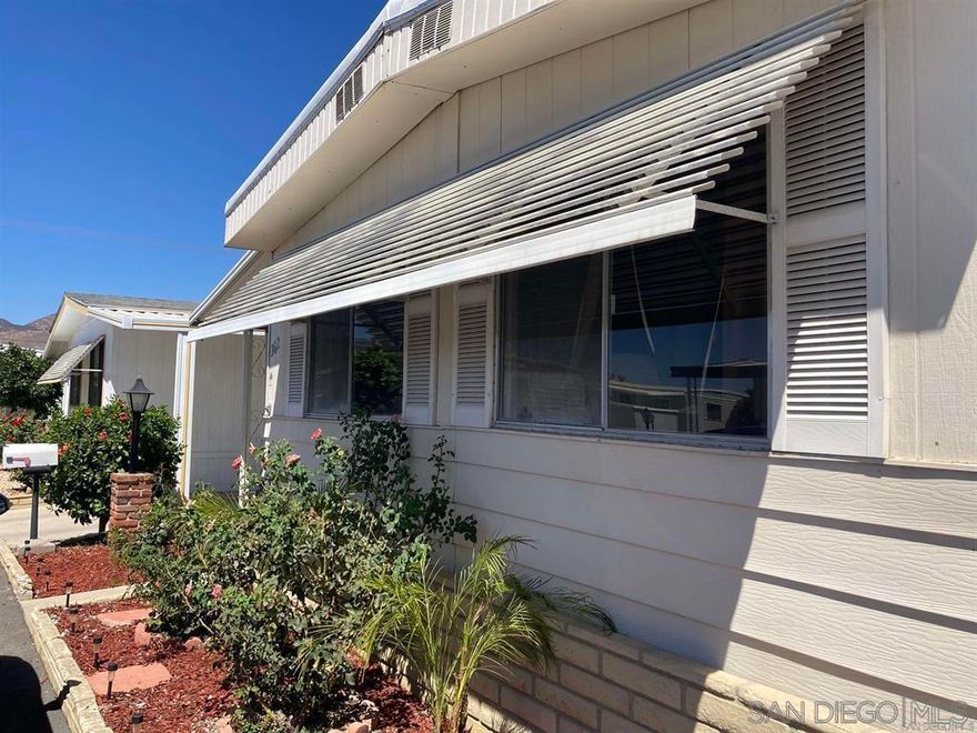 LAND LEASE and Welcome to a sound and stable loving home. To support that, a recently newly replaced roof, recently new interior plumbing, recently new carpeting and laminate flooring all stable additions. Relax in your home and enjoy the views of the gorgeous mountains and blue sky. Storage is always important so enjoy the two sheds and stock up. This + 55 Park has one of the lower space rents in the community. Park choice is important, Casa Del Rey Park offers two clubhouses, billiard, enclosed Jacuzzi, BBQ and study in a library, swim your laps in the swimming pool. Continuing your activities in the gym to workout.  INVESTORS that might be interested contact Listing Agent to learn about renting out the unit for good returns.  Seller will consider negotiating price deal on furnishings. Casa Del Rey is a +55 Park with amenities and features for all neighbors to get together and enjoy fun.