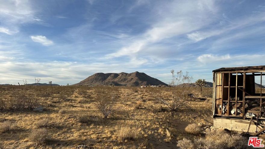 Embrace the opportunity to create your desert oasis on this stunning 5-acre lot in the heart of Landers. Zoned HV/RL-5, this expansive property is the ideal setting to build your dream home, surrounded by breathtaking desert landscapes and majestic mountain views. Enjoy the tranquility of rural living while staying just a short drive from the vibrant shops, restaurants, and attractions of Joshua Tree and Yucca Valley. Whether you envision a modern retreat, a rustic getaway, or a place to reconnect with nature, this property offers endless possibilities. Your desert escape awaits!