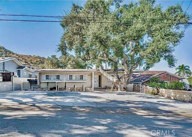Nestled in the peaceful foothills of Sunland, 10143 Oro Vista Ave offers a rare opportunity to own a home surrounded by natural beauty and wide open space. While this property could use some tender loving care, it boasts incredible potential for the right buyer to create their dream retreat. The layout features spacious living areas filled with natural light, and the expansive lot is ideal for outdoor living, gardening, or entertaining. Whether you're looking to renovate, expand, or simply enjoy the tranquil setting, this property is a true hidden gem with endless possibilities.