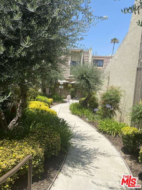 Corner unit in well manicured and gated Tarzana Villas North. Upon entering the unit there is a foyer adjacent to the large living room with fireplace and high ceilings. The next level has the dining area and spacious kitchen with granite counters and breakfast area. The same level includes a den or 3rd bedroom and a half bath. Upstairs are the 2 bedrooms, both with ensuite bathrooms. There is an oversized front patio to the unit with brick flooring and room to relax outside. Stairs from the main floor lead down to the good sized 2 car garage with laundry. The common area in the complex includes pool, spa, rec room and sauna. The complex has a close proximity to shopping, restaurants and easy freeway access. HOA includes Earthquake Insurance. Don't miss this great value and opportunity to be a homeowner!