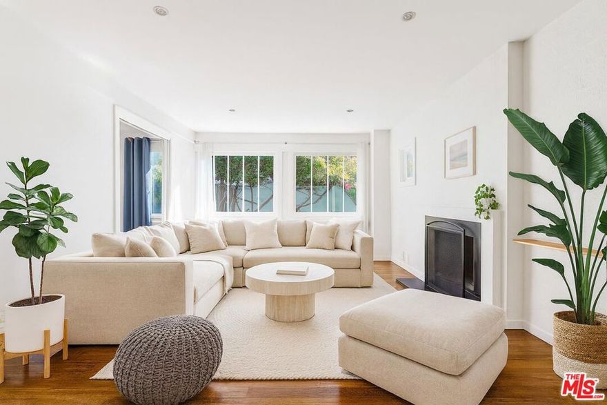 Charming Craftsman on Electric  Your Private Venice Sanctuary! Flooded with natural light from multiple skylights, this beautifully updated 3-bedroom, 2-bath California Craftsman bungalow perfectly blends timeless character with modern comforts. White walls and warm hardwood floors create a breezy, beach-inspired ambiance, while pitched ceilings and exposed beams showcase classic architectural charm. The updated kitchen and bathrooms offer modern convenience, while two sets of French doors open seamlessly to a spacious private outdoor retreat featuring a shaded pergola and a flourishing grapefruit tree.This gated compound offers peace and privacy just moments from the beach, and only a short stroll to the boutiques, dining, and nightlife of Abbot Kinney. Includes one dedicated parking space.