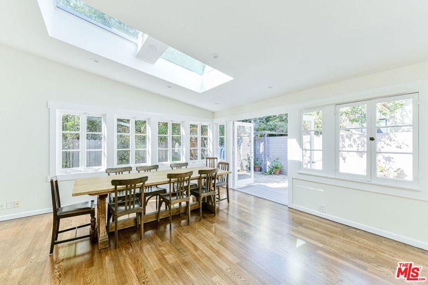 Charming Craftsman on Electric  Your Private Venice Sanctuary! Flooded with natural light from multiple skylights, this beautifully updated 3-bedroom, 2-bath California Craftsman bungalow perfectly blends timeless character with modern comforts. White walls and warm hardwood floors create a breezy, beach-inspired ambiance, while pitched ceilings and exposed beams showcase classic architectural charm. The updated kitchen and bathrooms offer modern convenience, while two sets of French doors open seamlessly to a spacious private outdoor retreat featuring a shaded pergola and a flourishing grapefruit tree.This gated compound offers peace and privacy just moments from the beach, and only a short stroll to the boutiques, dining, and nightlife of Abbot Kinney. Includes one dedicated parking space.