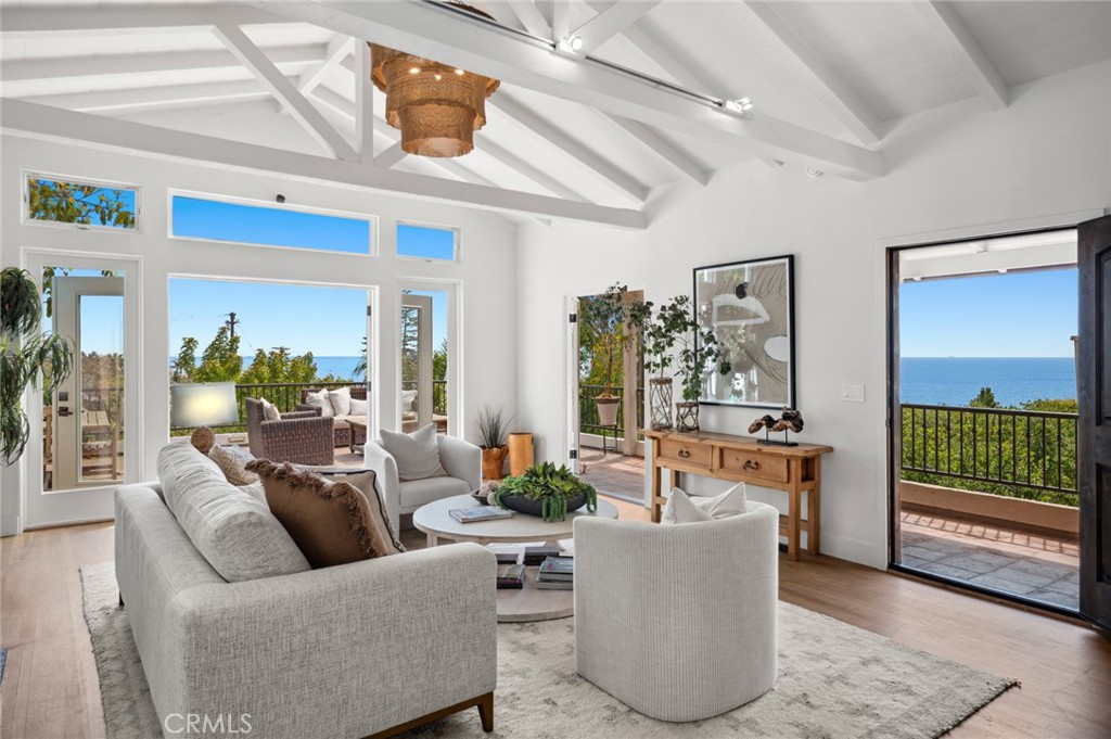 Spanish Villa with Ocean Views & Walk-to-Beach Lifestyle
Discover the best of Laguna Beach living in this authentic Spanish villa on a premier Laguna Royale street. Just a short stroll to iconic West Street and Table Rock beaches, this home blends timeless charm with modern coastal design.
Enjoy sweeping ocean views, multiple patios, decks, and terraced gardens—perfect for outdoor dining, hammock lounging, or sunset watching. Rare for Laguna, the property includes an attached two-car garage plus additional parking for four.
The main level features an open-concept living room, dining, and chef’s kitchen with French doors, high ceilings, wood floors, and a fireplace. The designer kitchen showcases custom cabinetry, quartz island, farmhouse sink, walk-in pantry, built-in coffee bar, and desk niche. An en suite guest bedroom is also on this floor.
Downstairs, the primary suite offers ocean-view serenity with a fireplace, spa-inspired bath, and direct access to outdoor spaces. A second en suite bedroom opens to a peaceful courtyard. Lastly, a wine cellar / office with private entrance is detached with direct access to the back gardens.
A rare find, this villa embodies the true Laguna lifestyle—authentic, private, and just steps from the sand.