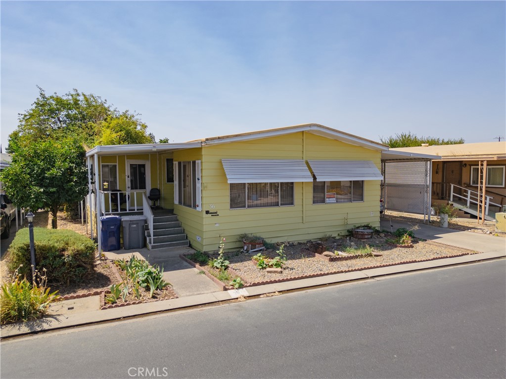 2-Bed, 2-Bath mobile home in a peaceful 55+ community. This bright and inviting residence features a spacious living room with large windows that fill the space with natural light, as well as a separate family room for added comfort. The kitchen offers ample cabinet space, granite countertops, and a functional layout. The primary suite includes mirrored closets, an ensuite bath with a relaxing tub. The second bedroom also enjoys direct access to its own bathroom. Additional highlights include ceiling fans, an indoor laundry room with cabinets, and a welcoming layout designed for easy living. Located in a friendly senior park, this home combines convenience, comfort, and community living.