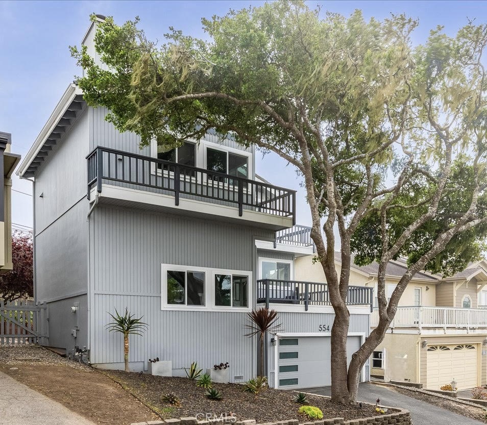 Situated in the coveted coastal community of Cambria, this charming and well-cared for home is close to a range of amenities including shops, restaurants, and the sea. Located on Park Hill, Moonstone beach is just a stone's throw away, offering endless opportunities for kayaking, surfing, or simply enjoying the sun. The outdoor areas of this home are truly exceptional. Two floors of ocean view decks provide the perfect spots for relaxing, entertaining, or simply soaking in the stunning surroundings. This comfortable home has vaulted ceilings and skylights, it is stunningly clean and painted with seaside colors.. A wood burning fireplace with gas log lighter anchors the living room. The bright kitchen has solid surface quartz counters, glass tile backsplash and an ocean view right from the kitchen sink. The kitchen is open to the adjacent dining room and ocean view deck. There are three bedrooms, two (including the primary suite) have ocean views and access to an ocean view deck. Both bathrooms are both modern and elegant. The backyard has a large deck and landscaped areas. The outdoor shower is ideal for rinsing off after a day at the beach, while the hot tub promises relaxation under the stars. A detached studio has vaulted ceilings and can be used for a variety of things…gym, crafts, family room. There is a bonus space of off the living room that could be used for additional storage or play room. This home also has a two car garage, EV charging outlet, and most of the beautiful beachy furniture is included with the sale. This home is more than just a place to live; it is a gateway to an idyllic coastal lifestyle. The ocean views are stunning and panoramic.