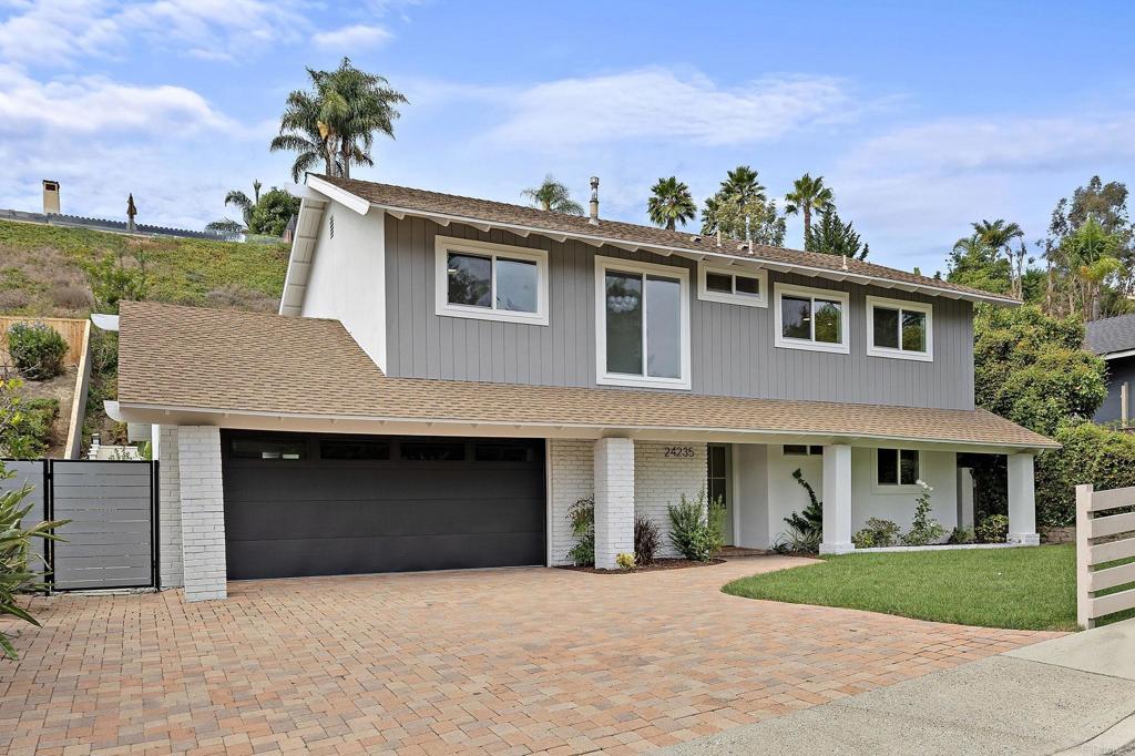 Laguna Niguel Sanctuary - Beautifully remodeled two-story in sought-after Pacesetter II with no HOA fees! Soaring ceilings and a cozy fireplace set the tone for light-filled living spaces that flow from dining with a built-in bar to a stylish family room. The chef’s kitchen impresses with oak cabinetry, a dramatic black island, premium appliances, and dual multi-fold doors opening to a private backyard—ideal for entertaining or relaxing. Upstairs, the primary suite offers a walk-in closet and spa-like bath, joined by three additional bedrooms and a full bath. A versatile downstairs bedroom with its own bath creates the perfect guest suite or office. Minutes from beaches, trails, and the Lantern District, this home delivers coastal living at its best.