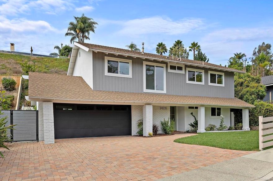 Laguna Niguel Sanctuary - Beautifully remodeled two-story in sought-after Pacesetter II with no HOA fees! Soaring ceilings and a cozy fireplace set the tone for light-filled living spaces that flow from dining with a built-in bar to a stylish family room. The chef’s kitchen impresses with oak cabinetry, a dramatic black island, premium appliances, and dual multi-fold doors opening to a private backyard—ideal for entertaining or relaxing. Upstairs, the primary suite offers a walk-in closet and spa-like bath, joined by three additional bedrooms and a full bath. A versatile downstairs bedroom with its own bath creates the perfect guest suite or office. Minutes from beaches, trails, and the Lantern District, this home delivers coastal living at its best.