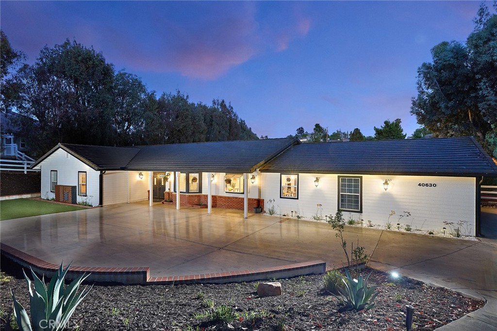 Nestled in the coveted Meadowview community, this exquisitely renovated ranch-style retreat captures the perfect balance of rustic elegance and modern sophistication. Set on a spacious lot with sweeping views, the home is a true entertainer’s dream where timeless charm meets designer style. From the moment you step inside, you’re welcomed by warm, natural tones, rich textures, and architectural details. The expansive open-concept layout is thoughtfully designed to flow effortlessly, offering both comfort and sophistication. The living room stuns with dramatic exposed beams and a striking brick fireplace creating a cozy yet elevated gathering space. The adjoining dining area is equally impressive and opens to a recently remodeled chef’s kitchen, featuring high-end finishes, sleek cabinetry, and premium appliances. Recessed lighting enhances the ambiance throughout, creating a warm and inviting glow from morning to night.
A gem awaits with a one of a kind kitchen; a luxurious butler’s pantry. It provides a perfect prep area for entertaining, allowing the kitchen to remain a beautiful focal point for family and guests. The primary suite offers a peaceful escape, complete with a spacious walk-in closet and a newly renovated spa-inspired en suite bath. Unwind in the oversized soaking tub or enjoy the seamless glass walk-in shower crafted for ultimate relaxation. French doors lead directly to the expansive covered patio, where dual ceiling fans and a charming porch swing invite you to slow down and savor the moment.
Designed for indoor-outdoor living, this home extends its hospitality to the backyard with newly installed synthetic turf offering the ideal setting for al fresco dining, lounging under the stars, or simply soaking in the tranquility of Meadowview’s rolling trails and equestrian paths, accessible just beyond your backyard. The home also has unique additions that include a chicken coop, garden area, and a green house. There are two detached sheds for plenty of storage. Additionally, the home has newly installed solar panels. Just minutes from Temecula's top-rated wineries and schools this home is located in the heart of Temecula. Community amenities include clubhouse, swimming pools and spa, sports facilities with tennis courts, park and play area, equestrian trails, and a 360 acre open meadow with an extensive network of trails for jogging, hiking, and biking promoting an active lifestyle.