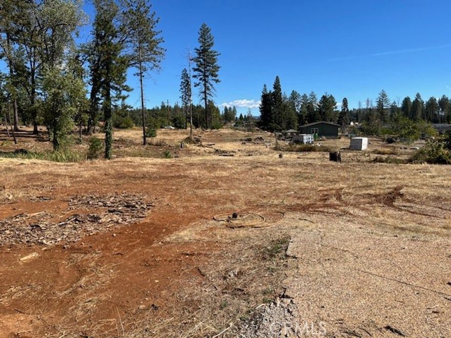 Bring your dreams to life on this over 1 acre parcel in Paradise! Formerly the site of a spacious 3 bedroom, 2 bath, 1,968 sq. ft. home, this property offers the perfect footprint for rebuilding. The seller is paying for the water connection, saving the buyer thousands in upfront costs. Enjoy the privacy and room to spread out while still being close to town conveniences. Close to shopping, stores, parks and more.