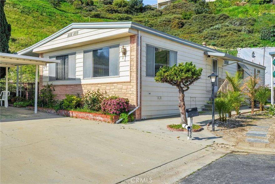 This is a Lovely Home that cuddles the Top of the Hill on the West Side of the Gorgeous and much Coveted Skyline Mobile Park in Torrance across from the Rolling Hills Plaza!! Great Views and Peaceful Surroundings!! A 1971 Doublewide Mobile Home with Lots of Space and Comforting Living Room Areas with a Fireplace, built-in shelves for your decorations and family pictures and cabinets for all your fine dining as you enjoy the Wonderful Views! The Kitchen has Ample room with all the necessary appliances and a serving table that invites and is across from the Lovely Mirrored Wet Bar!! The Master Bedroom with it's walk through closet to the adjoining Bathroom, is a wonderful place to rest your head at the end of the day!! The Guest room also has an accompanying entrance to another convenient adjoining bathroom!! But lets talk about the large decked patio with the lovely greenery on the hillside  and the area designated for your perfect barbeque!! Relax and enjoy, and give your guests up to 5-6 Parking Spaces that go with the home!! This park has Amenities Galore, Olympic Sized Pool, Jacuzzi, Large Clubhouse with Large Kitchen Area, Pool Tables, Dartboard and an attached Library!! Skyline Mobile Park is a Very Social Community and there is always something to do, if your heart desires!! This is a Wonderful Home in a Wonderful Community that is happy to welcome you!! See you soon!!