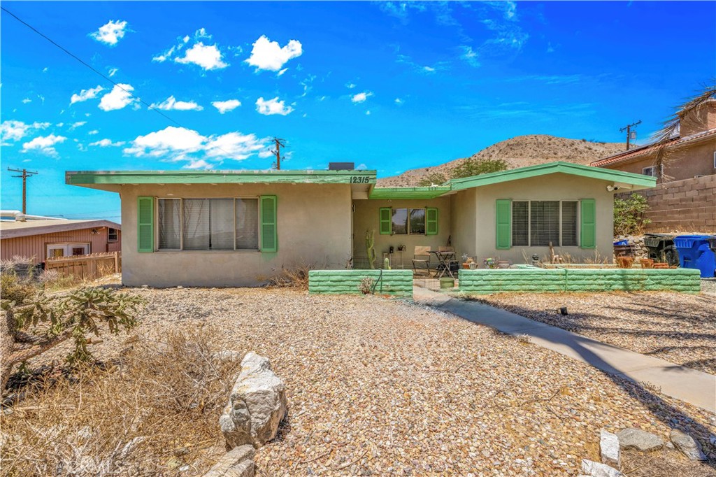 INVESTORS, INVESTORS, INVESTORS Opportunity Knocks in Desert Hot Springs! This desert gem is exactly what you’ve been waiting for. Located in the heart of Desert Hot Springs, this 3-bedroom, 2-bathroom home comes with a detached casita and a sparkling private pool the perfect setup for resort-style living, income-generating potential, or your next high-return investment project. With a few personal touches and thoughtful updates, this home offers the chance to build instant equity and create something truly special. Step inside to discover soaring cathedral ceilings and a spacious open-concept layout filled with natural light. The living room flows seamlessly into the kitchen and dining area, making it ideal for both everyday living and entertaining. Outside, enjoy your own private backyard oasis with low-maintenance desert landscaping, a refreshing pool, and breathtaking mountain views all with no rear neighbors. Your backyard opens to wide-open desert, offering unmatched peace, privacy, and natural beauty. The detached casita offers incredible flexibility and value. Use it as a guest suite, home office, or short-/long-term rental unit the options are endless. Situated just minutes from Cabot’s Pueblo Museum, renowned hot mineral spas, and only 20 minutes from downtown Palm Springs, the Palm Springs Aerial Tramway, and world-class dining, shopping, and art. This home is packed with potential. Whether you’re an investor or someone looking for a customizable retreat, this is a rare opportunity in one of Southern California’s fastest-growing markets. Don’t miss your chance to unlock the full potential of this desert retreat!
