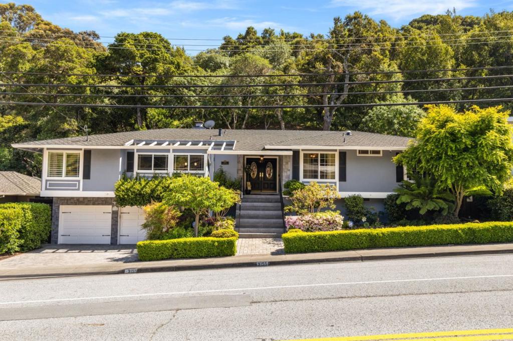 Welcome to 3155 Brittan Avenue, a beautifully updated residence nestled in the serene hills of San Carlos. This inviting home offers a perfect blend of comfort and convenience just minutes from vibrant downtown and top-rated schools. Step inside to discover a light-filled interior with gleaming hardwood floors and large windows that frame stunning natural scenery. The thoughtfully designed kitchen features sleek countertops, stainless steel appliances, Wolf 6-burner stovetop and ample cabinetry ideal for both everyday living and entertaining. Enjoy seamless indoor-outdoor living with direct access to a private deck and patio perfect for morning coffee, summer dinners, or simply taking in the peaceful hillside views. Additional features include: owned solar, oversized garage, ample storage space, Toto toilets, newer windows, mature landscaping and more. Located in one of San Carlos most desirable neighborhoods, this home combines tranquility with convenience offering easy access to freeways, parks, hiking trails and everything the City of Good Living has to offer.
