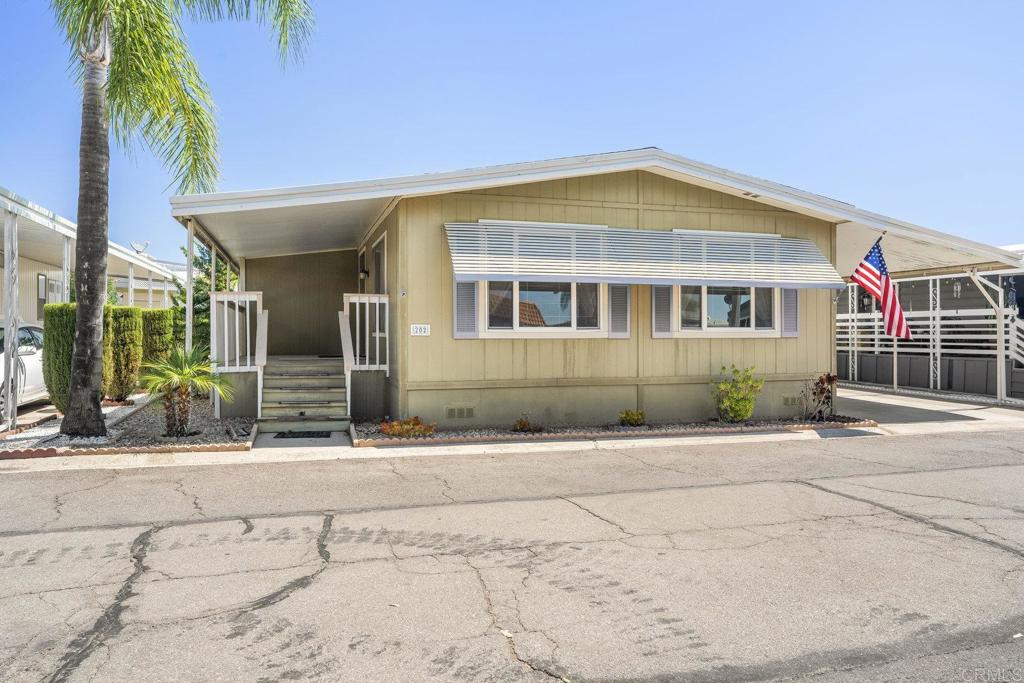 Welcome to 1212 H Street #202 in the highly sought after 55+ community of Ramona Terrace Estates. This charming manufactured home features a light-filled floor plan with spacious living areas, a well-appointed kitchen, and a cozy dining space. Rest and unwind in the oversize primary bedroom and bathroom featuring dual sinks, walk in shower and closet space. Enjoy relaxing on the covered porch or the smell of citrus from one of the fruit trees in the yard. The home features a covered carport as well as storage shed for additional room for your belongings. Residents have access to resort-style amenities offering comfort and convenience including a clubhouse, pool, spa, and social activities all for a minimal space rent. Located in the heart of Ramona, you’ll be close to shopping, dining, and all the charm of small-town living.