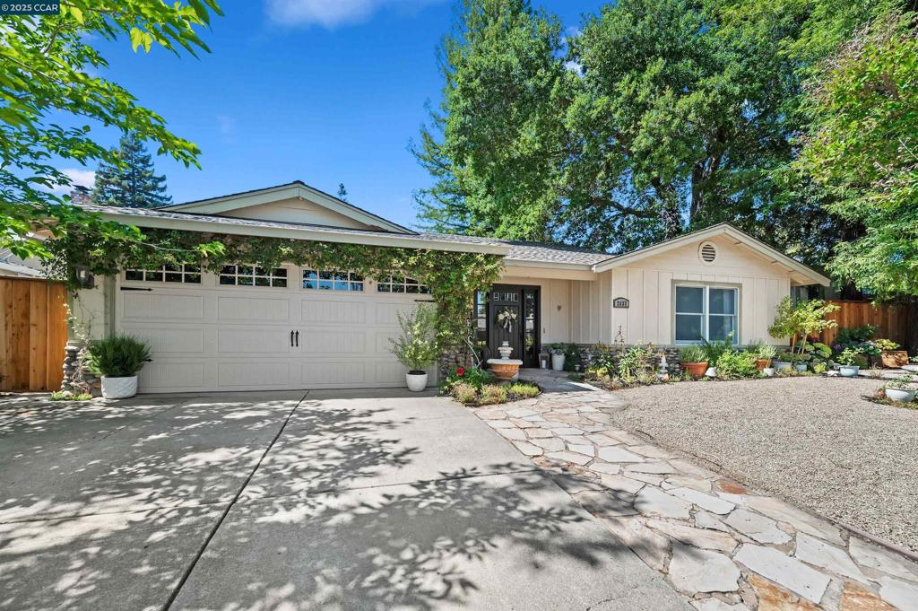 Gorgeous single story with no steps to entry. Chef's kitchen with 6 burner Viking Gas Range, Island, Cherry Cabinetry, stainless steel appliances, tile counters and flooring. Light and bright with skylight, vaulted ceilings, recessed lighting, and crown moulding. French doors open to the lush English style gardens in the back of the home. Serene landscape graces the east side of the home for your own little oasis. There is even a playhouse and upper deck viewing area as an added escape. The primary bedroom has a generous walk in closet. Walk to Award Winning San Ramon Unified School District schools, also Athans Downs park. Easy access to I-680 for an easier commute.