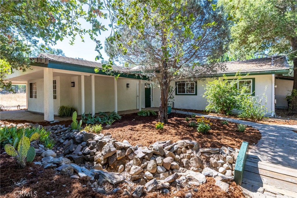 Welcome to this cherished 5 bedroom, 3 bathroom home offering nearly 3,000 square feet of comfortable living with timeless character and thoughtful updates throughout. Designed with a spacious open layout, the home is filled with natural light streaming through the numerous windows and features beautiful laminate flooring that flows through most of the home. Designed with flexibility in mind, the layout offers 2 bedrooms and a bathroom toward the front of the home, treat it like a junior ADU or leave it open to be part of the home. At the heart of the home is an expansive chef’s kitchen, complete with a commercial-grade stove, dual sinks, granite countertops, an abundance of cabinetry and a cozy dining nook with built-in bench seating and hidden storage — perfect for casual meals or morning coffee. Each of the five bedrooms offers generous space and unique charm, with two featuring delightful window seats with built-in storage. The 3 bathrooms exude vintage elegance with clawfoot tubs and stylish tile finishes, blending classic beauty with everyday function. The expansive primary suite offers a peaceful retreat, with a luxurious ensuite bath featuring a clawfoot tub, glass block shower and ample space to unwind. A connected bonus room — currently used as an office — provides added flexibility for your lifestyle needs. Step outside to enjoy the fully fenced backyard, a true outdoor haven complete with a lush olallieberry patch, raised garden beds, a large workshop and your own private pool and spa for year-round enjoyment. Perfectly located near schools and with quick freeway access, this home offers the ideal balance of convenience and coastal living. Homes like this don’t come around often—come experience the charm and space for yourself before it’s gone! Please review the Virtual Tour for more information.