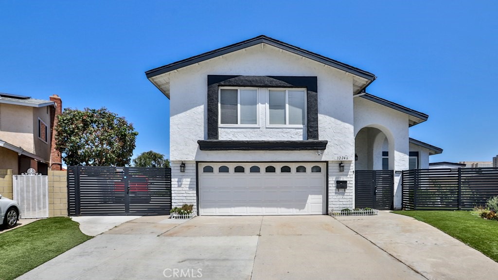 If you are looking for living or a vacation home in Southern California, this is the first choice to be the new owner of this estate just 2 miles away from one of the really famous places in the world, DISNEYLAND. Home has been totally upgraded, with an iron fence surrounding the front yard and RV gate. Single door entry of Cathedral home style with high ceiling and containing a bunch of designated chanticlear & lights, features 4 bedrooms, 2.5 bathrooms, huge living room and dining area. There is one bedroom and 1/2 bath for guests on the main floor; separate private kitchen with a lot of cabinets, tile and vinyl flooring throughout the house. Upstairs has 2 master bedrooms, plus all beautiful blinds & curtains on all windows & doors. The large back yard has a covered patio great for entertaining guests, with super clean and nice landscaping, 2 cars garage with a large driveway for 2 more cars and a RV that can drive through in the backyard. There is an upgraded tankless water heater. Located in the heart of Garden Grove, walking distance to Elementary & Middle School, Garden Grove Central Library, Church, Anaheim Resort, Anaheim convention Center, Great Wolf Lodge Water Park, Coastline College, Costco, Freeways 22 & 5.