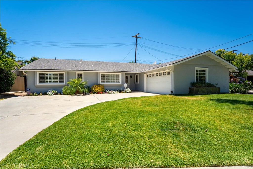 Welcome to this stunning Charles DuBois Mid-Century Ranch, a spacious single-story gem in the best pocket of Woodland Hills -South of the Blvd adjacent to Calabasas! This freshly painted 3-bedroom, 2.5-bathroom home offers 2,010 sq ft of well-designed living space on a generous 8,000+ sq ft lot, blending timeless style with modern comfort.
Step through the formal entry into an airy living room featuring a high, beamed ceiling, cozy fireplace, and views of the sparkling pool and spa. The open floor plan is ideal for entertaining, with a seamless flow into the dining area and the beautiful kitchen — completed with granite countertops, a breakfast bar, a charming garden window, and an inviting family room combination.
The large primary suite is a true retreat with its own full bathroom, plenty of closet space, and view of the backyard oasis. Two additional well-sized bedrooms share a full bathroom, plus there’s a convenient powder room for guests.
Additional highlights include beautiful wood floors, partial recessed lighting, crown molding, smooth ceilings, central air and heat, and an inside laundry room off the attached two-car garage with direct access.
The private backyard is perfect for relaxing and entertaining with a sparkling pool, rejuvenating spa, mature fruit trees, and a spacious covered patio for dining al fresco.
Ideally located within walking distance to the Calabasas Farmers Market, The Commons at Calabasas, and the best shopping and dining along Ventura Blvd. Zoned for award-winning schools — Calabash Charter Academy, Hale Charter Academy, and El Camino Real Charter High School — this home checks all the boxes for comfortable family living.
Don’t miss this rare opportunity to own a classic Charles DuBois ranch-style home in prime Woodland Hills!
Photos are virtually staged.