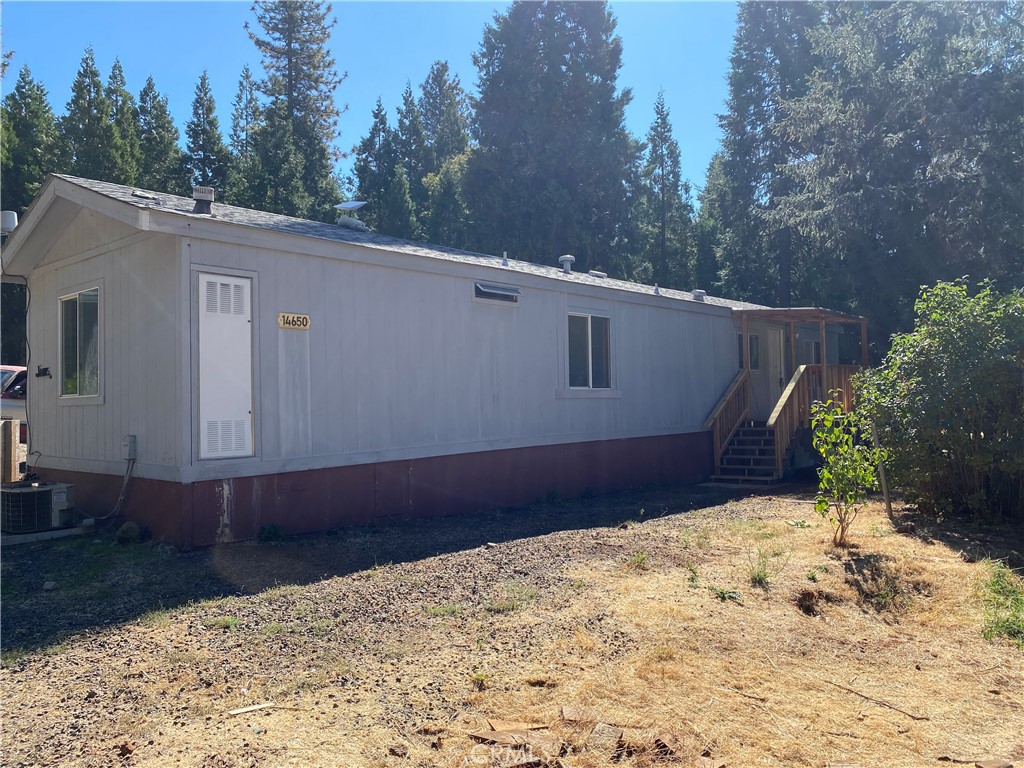 AFFORDABLE HOME WITH BIG PARCEL! Check out this great opportunity located on Nimshew rd, just a few minutes from the heart of Magalia. This property offers a 1991 Manufactured home with 2-bedrooms and 1-Bath with 840+/-SqFt on a sizable .95-Acre lot, with an old barn, large carport and multiple storage buildings. The home has a large great room at one end, open to the kitchen area and a hallway accessing the bedrooms and bathroom. The home also has wooden porches front and rear to help access the home. There is also plenty of usable land and even has a fenced garden area perfect for fruit trees and your home gardening desires. Take a look at what this home and property have to offer! Properties like this are few and far between! Don’t miss the great recreational opportunities in the area including lakes, hiking, biking, fishing, ATV and dirt-bike riding, canoeing, kayaking and much more! Take a look at this great opportunity to build SWEAT EQUITY!