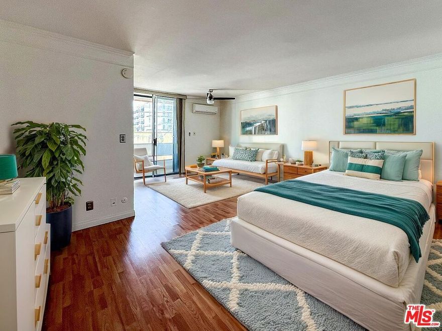 Discover exceptional value in the heart of Koreatown. This bright, east-facing studio offers rare natural light and a private outdoor space set quietly at the back of the building with no neighboring structures blocking the view. The efficient layout makes the most of every square foot, featuring laminate floors, a full kitchen, and generous closet storage. Enjoy the convenience of assigned, secured parking, a newly painted exterior, and a location that places you steps from cafes, gyms, and some of LA's best dining. Minutes from Downtown LA, Hollywood, and major transit lines, this residence is ideal for first-time buyers, professionals, and frequent travelers seeking a low-maintenance home base in one of the city's most dynamic neighborhoods. A smart alternative to renting, offering more space and light than other studios in this price range. This property may be eligible for the Community Advantage Program, which can offer as little as 3% down, no PMI, and up to $1,500 in credits toward closing costs, helping reduce upfront expenses and monthly payments. Program terms, rates, and availability are subject to lender approval, qualification, and current financial conditions.
