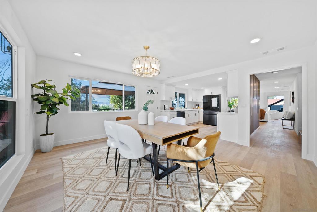 Looking for a home that has everything, and at a great price? You found it! Enjoy this stunning modern home in the desirable and quiet Heavenly Heights neighborhood of Escondido! Beautifully remodeled with contemporary designer finishes. This spacious home offers 4 bedrooms, 3.5 bathrooms, and 2,058 sq ft of living space on a 16,000 sq ft lot. No HOA or Mello-Roos. Gorgeous views of Escondido, including breathtaking sunsets and 4th of July fireworks! Step inside to an elegantly designed home with abundant natural light and a breathtaking chandelier. The chef’s kitchen features quartz countertops, sleek custom cabinetry, and stainless-steel appliances (including a smart refrigerator). The kitchen flows seamlessly to a formal dining room, and family room- perfect for entertaining. Dual primary suites are serene retreats with beautifully appointed bathrooms. Secondary bedrooms offer flexibility for family, guests, home office, or creative space. A hidden nook off the hall provides the perfect reading corner, play space, or extra storage area. The expansive lot provides a multitude of options: Build a backyard oasis with a sparkling pool, create income potential by adding 1-2 ADUs, or use the large space to store your RV/Trailer/Toys. The ample space doesn’t stop here. An attached 2-car garage contains a large hidden workshop above- private space for hobbies, relaxation, or entertainment. The extra-long driveway, plus another separate RV/Trailer/Boat parking area guarantees more than enough space for all you desire! You can have all of this in one of Escondido’s most sought-after neighborhoods. With quick access to shopping, dining, the 15 FWY, Del Dios HWY and top-rated schools- it is a must-see for anyone desiring space, privacy, comfort, and unlimited possibilities in their dream home.