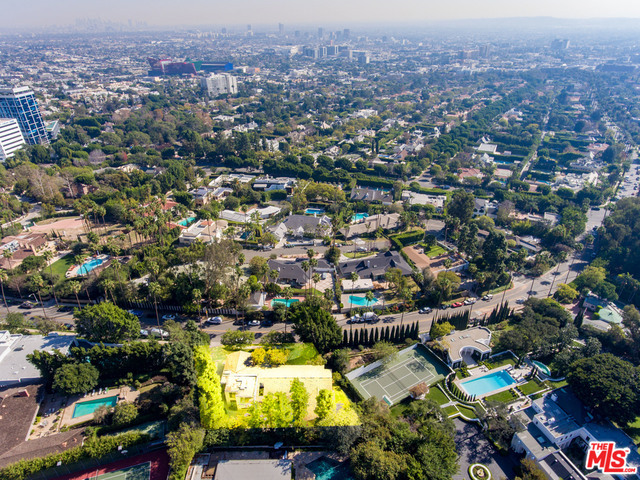 Located on what is considered one of the most prestigious blocks north of Sunset, the Hillcrest contemporary home features 5,177 square feet and it's on a 26,607 square foot lot. Perfect for a developer and/or end user, the five bedroom home features magnificent and 14 foot ceilings and fabulous walls of glass! Light and bright, this home is perfect for entertaining and has a wonderful floor plan. Private and set back off the street, the Hillcrest home is located two minutes from the Beverly Hills and four minutes from Rodeo Drive. By far the most aggressively priced home north of Sunset, this property is ready to be sold for the first time in decades. Offer due by 12pm Friday February 16, 2018.