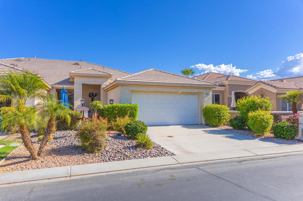 For lease! Season or annual lease (seasonal rates apply). Experience the ultimate desert lifestyle in this beautifully furnished home, located within the sought-after 55+ guard-gated community of Heritage Palms Country Club.This well-maintained 2-bedroom, 2-bathroom home with a charming front courtyard, offers a spacious and versatile layout, featuring tile flooring and LVP throughout the home, a generous living room, and a formal dining space perfect for entertaining.The kitchen opens to a cozy family room complete with a gas fireplace, casual dining nook, and bar seating, ideal for everyday living. Step outside to the private, enclosed backyard and enjoy serene mountain views in a peaceful setting.The expansive primary suite features dual vanities, a walk-in shower, and two separate walk-in closets for ample storage. A roomy laundry area provides extra cabinetry and leads to the attached 2-car garage with epoxy floors and additional built-in storage.Residents of Heritage Palms enjoy access to world-class amenities, including a championship 18-hole golf course, resort-style clubhouse, indoor and outdoor pools, pickleball and tennis courts, fitness center, library, restaurant, lounge, and a full calendar of social activities.