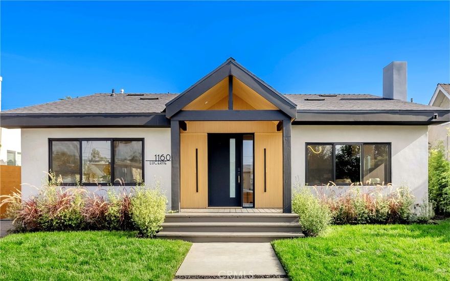 Set in the heart of highly sought-after Mid-Wilshire, this modern compound blends architectural sophistication with everyday comfort. A fully rebuilt 3-bed, 3-bath main residence and brand-new 1-bed, 1-bath ADU together span 2,400 + sq ft, offering endless possibilities for multi-generational living, creative flexibility, rental income, and much more.



Vaulted ceilings and light oak wood floors flow throughout both homes, filling each space with natural light and effortless style. The main home’s open-concept living area introduces a chef’s kitchen distinguished by sleek European cabinetry, custom porcelain surfaces, and integrated smart appliances. The primary suite provides a tranquil escape, featuring a walk-in closet and microcement-finished spa bathroom with a freestanding soaking tub and dual shower heads. Two secondary bedrooms and designer baths round out the residence in elegant fashion.



Open the French doors to an inviting wraparound deck leading to the newly built ADU—a statement of its own with vaulted ceilings, modern finishes, and a complete kitchen mirroring the main home’s aesthetic. The ADU’s bi-fold doors blur the line between indoor and outdoor living, connecting seamlessly to the shared deck—ideal for guests or entertaining.



Every major system has been thoughtfully replaced—HVAC, electrical, plumbing, and more—ensuring lasting comfort. The property also offers an EV-ready connection and a finished garage that flexes as a gym, studio, or office. Fully realized and move-in ready, this home captures the essence of contemporary Los Angeles luxury.



The first OPEN HOUSE is SUNDAY, Nov 9 from 1-5pm. OFFERS DUE and will be reviewed Nov 17.