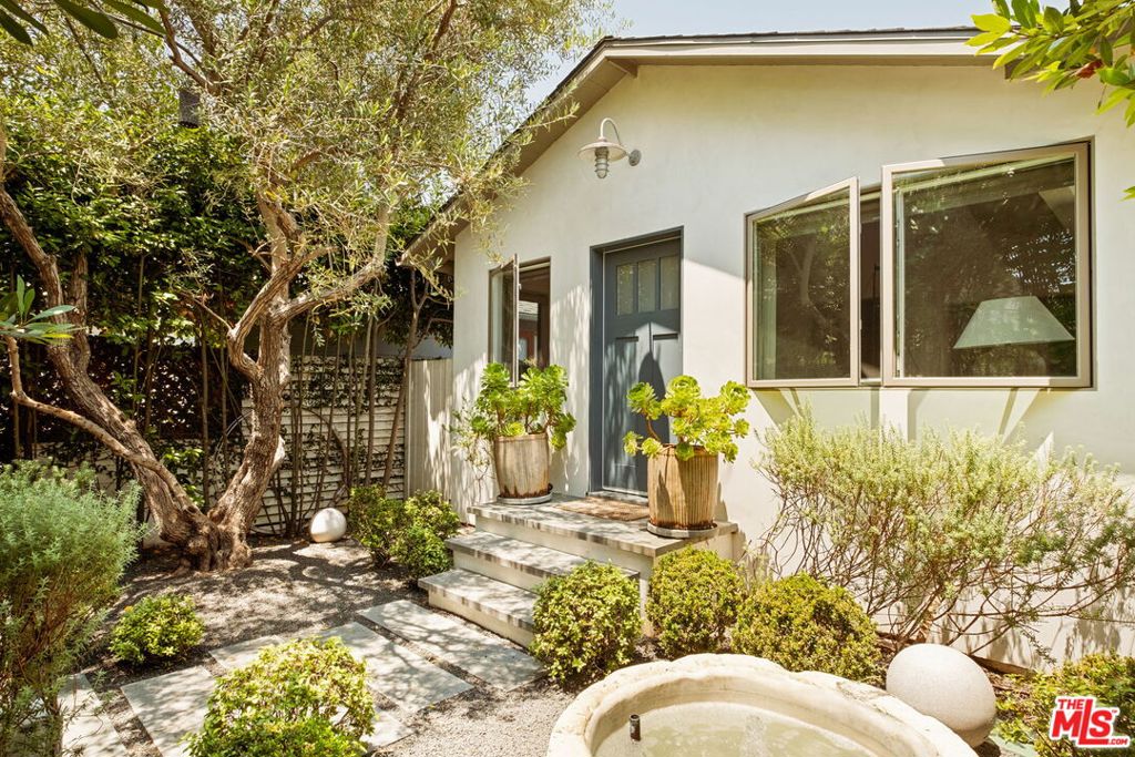 An Impeccable, Designer-Done Beach Bungalow in the heart of Ocean Park. Step beyond the gated entry and mature olive trees into a private oasis where peace and refinement meet. Tucked in on one of Ocean Park's best streets, this revitalized beach bungalow - originally reimagined by acclaimed designer Chad Eisner - offers an extraordinary living experience defined by simplicity, quality, and thoughtful craftsmanship. Inside, every detail has been curated to perfection. Wide plank oak floors, custom plaster walls, and wood-slatted ceilings set a warm, organic tone, while an entertainer's kitchen and Savant audio system seamlessly blend form and function. Indoor spaces flow effortlessly to the outdoors, creating a harmonious connection to nature throughout. The generous primary suite, nestled at the rear of the property, features a custom built-in office space and opens directly onto a lush garden sanctuary complete with a fire pit and barrel cedar jacuzzi - an ideal retreat for both productivity and relaxation. A tranquil water feature greets you at the entrance, setting the tone for the serenity that defines this home. With a newly installed solar system to help reduce utility costs, this is a truly rare opportunity to lease a property that feels like a permanent vacation. In today's world, where home is more important than ever, this sanctuary offers an unparalleled sense of calm and inspiration.