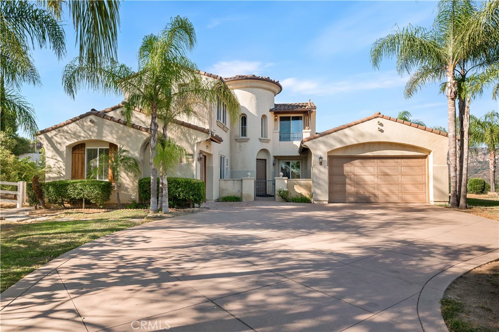 Welcome to 25055 Jack Rabbit Acres—a beautifully upgraded Panoramic-View Estate home situated on 1.59 acres in the rolling hills of Escondido. With 5 bedrooms, 3 full bathrooms, a loft, and a dedicated office, this 3,788 sq ft two-story residence offers the perfect balance of space, comfort, and breathtaking views from nearly every room. Step into the formal entry with soaring ceilings, leading to a spacious living room and separate formal dining area. The heart of the home is the open-concept kitchen, complete with granite countertops, a walk-in pantry, breakfast bar, and stainless steel appliances—seamlessly flowing into the expansive great room, ideal for entertaining. The expansive primary suite offers a spa-like retreat with dual vanities, a soaking tub, and two large walk-in closets. Additional highlights include a cozy fireplace, separate laundry room, and built-in media niches. Upstairs, you'll find a versatile loft space and additional bedrooms that capture the home’s sweeping territorial views. Outside, enjoy expansive patio and lawn areas perfect for gatherings, gardening, or simply soaking in the scenery. The oversized 3-car garage offers plenty of room for vehicles, toys, or workshop projects. Set in a peaceful hillside enclave, this property enjoys elevated terrain that welcomes cool westerly breezes and unobstructed sunset views. The dramatic architectural entry with turreted front and circular stairwell makes an unforgettable first impression, with soaring ceilings, elegant chandelier lighting, and custom iron-and-wood railings that define the home’s timeless Mediterranean style. Located just minutes from downtown Escondido yet tucked into a peaceful, view-rich setting, this property blends refined living with the privacy and charm of country life. A rare opportunity to own a beautifully upgraded estate in a sought-after North County location. This is the kind of home where life opens up—indoors and out. Schedule your private showing today.