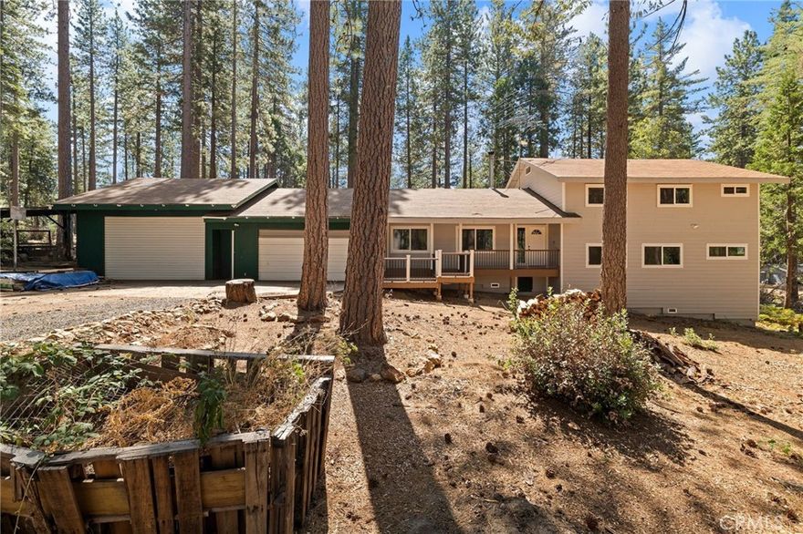 Discover the perfect blend of privacy, space, and opportunity with this rare 25.23-acre property in Magalia featuring two spacious homes. Tucked away on a private road, this property offers room to spread out. The first home is a split-level design with 2,681 sq. ft., offering 4 bedrooms, 2.5 bathrooms, a dedicated office, and two cozy wood stoves. Upgrades include a Generac generator, water softener, and water filtration system. A large shop provides endless options for projects, storage, or hobbies. Renovation work has been started, allowing you the chance to customize and finish it to your taste. The second home is equally impressive at 2,698 sq. ft., featuring 2 bedrooms, 2 bathrooms, plus an additional room with a closet that could easily serve as a 3rd bedroom plus another office space. With 3 wood stoves you will be cozy and warm all winter long. This home has an RV pad with full hookups and a structure to cover an RV/boat/tractor.  A large shop adds even more functionality and storage. With over 25 acres of serene land, this property is ideal for those seeking a private retreat, multigenerational living, or space for agricultural or recreational use. Whether you’re looking to create your dream homestead, complete a renovation project, or enjoy a peaceful lifestyle surrounded by nature, this property offers endless possibilities.