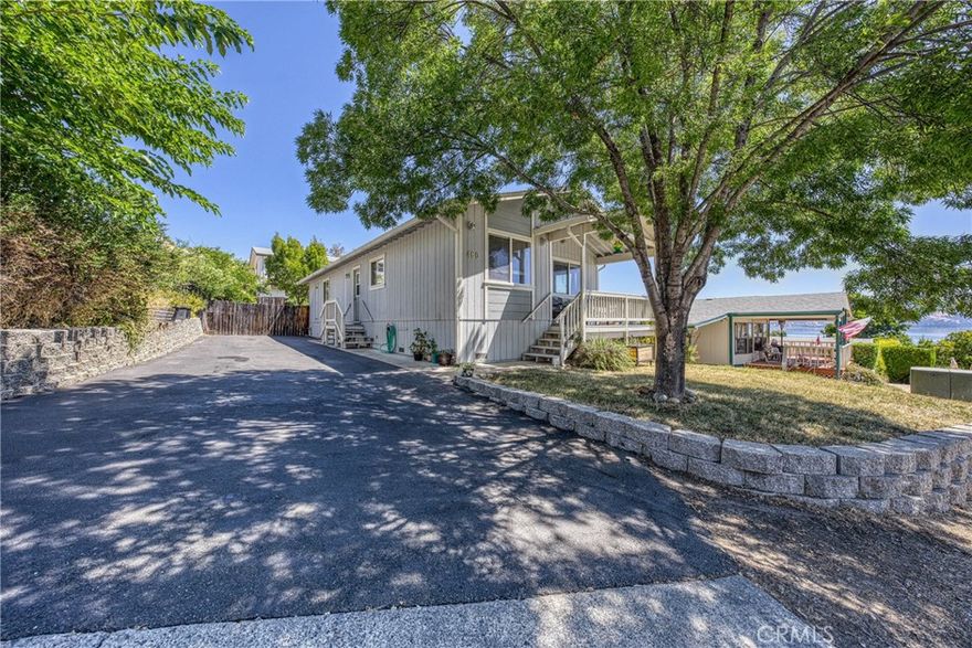 Custom Lakeview home located in North Lakeport! This home offers 2 bedrooms plus an office, all within an open floor plan that provides stunning views of the lake. It's truly a unique opportunity as it's being listed for the first time since it was built in 2005. The sunny front porch is a welcoming feature, perfect for enjoying sunrises, sunsets, and the serene lake scenery. Inside, the open floor plan seamlessly connects the kitchen, which boasts ample countertops, a range, and a dishwasher. For convenience, there's an interior laundry room located just off the side door, adjacent to a long driveway that can accommodate multiple cars or even a boat. The primary bedroom includes an en-suite bathroom, while the second bedroom and office share a hall bath with a tub/shower. The living room, with its views of Clearlake, is accessible from the main entry and covered front deck. Outside, a fenced and flat backyard provides a great space for outdoor activities. This home is ideally located close to the hospital, schools, and shopping, and is only 30 minutes from Ukiah. Additionally, it offers deeded access to a community boat launch, allowing for year-round fishing and water sports on Clearlake.
