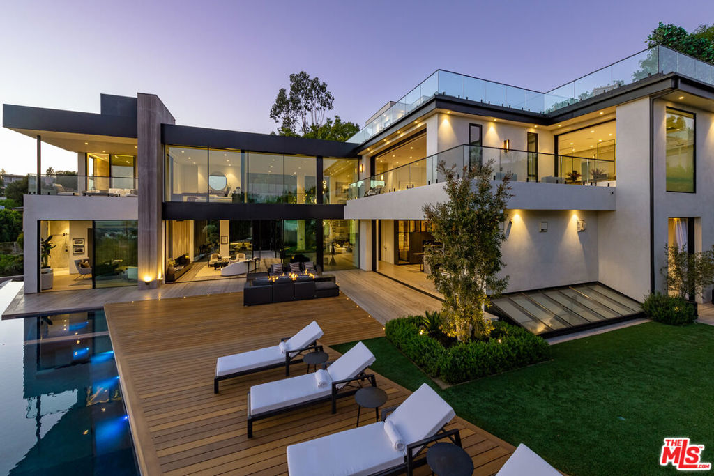 Exceptionally engineered, state-of -the-art architectural home situated in Beverly Hills P.O. featuring a seamless indoor /outdoor lifestyle with jetliner views from Century City to the Pacific Ocean. Combining an elegantly warm organic curation with cutting-edge technologies is the latest Masterpiece from Jae Omar Designs. With a culmination of the rarest, most unique materials and finishes sourced from around the globe this modern technologically advanced smart home boasts impressive scale rooms with high ceilings throughout, a 10 car gallery garage, soundproof Dolby Theater, world class gym with spa, Luxurious Master suite with showroom quality closet & spa inspired bathroom, impressive water and fire features, a rooftop terrace, temperature controlled wine room, cigar lounge and much more. Within minutes to the Beverly Hills Hotel and Rodeo Drive, this property affords its buyer the finest living experience possible surrounded by the finest dining and leisure Beverly Hills has to offer.