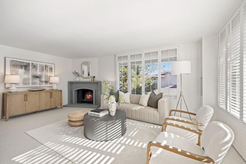 Welcome to 62 Lyonridge, a beautifully renovated 3-bedroom, 2.5-bath townhouse that lives like a single-family home. Ideally positioned as an end unit, this light-filled residence offers exceptional privacy and tranquil views of lush greenery and open space. The main level features a spacious living room with dramatic floor-to-ceiling windows that fill the home with natural light, while the private deck provides a serene spot for morning coffee or evening relaxation. The remodeled kitchen features brand new appliances and a comfortable eat-in area, ideal for everyday meals or casual dining. Just off the kitchen, an additional sitting room offers a comfortable space for casual gatherings or a cozy place to unwind. Updated bathrooms, refinished parquet floors, and new carpet throughout complete the homes fresh, move-in-ready feel. Upstairs, the large primary suite offers a peaceful retreat with a walk-in closet and a beautifully renovated en suite bath. Additional highlights include an attached two-car garage with laundry hookups, and a prime location near Highway 92, the College of San Mateo, and Laurelwood Shopping Center. Zoned for highly regarded Aragon High School, this home perfectly blends comfort, style, and convenience in one of San Mateos most desirable neighborhoods.