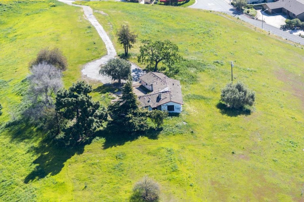 If You are Looking for a Spectacular Deal with Phenomenal Views of the Valley, Here it is! San Jose Country Club Location. 6.7 Glorious Acres with a Good flat 2 Acres +/- at the Top of the Knoll. Country Feel But in City Location. Existing Home can be updated or Removed at Buyers Cost. Build Your Own Custom Estate. If You Are a Builder Then Compare the Value to Other Sites. Rock bottom pricing, Huge upside and potential.
