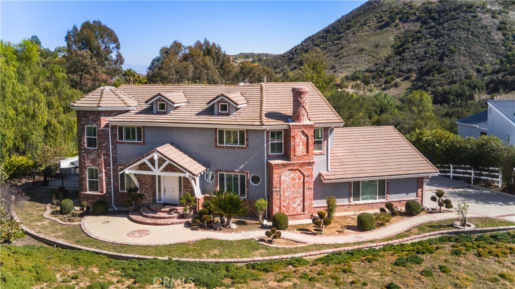 Step into this exquisitely remodeled 3-bedroom, 5-bathroom estate in the prestigious, gated Bell Canyon community. Recently Complete Remodeled in 2022, this home blends modern luxury with timeless charm, offering a perfect balance of style, comfort, and functionality. As you enter, a grand staircase sets the tone for the expansive, open-concept floor plan. The sun-drenched living room invites relaxation, while the spacious family room offers a cozy yet large area for more activity. windows and doors shutters. wood Beyond the living room, the elegant dining room is perfect for dinner parties or intimate meals. The chef-inspired kitchen is a culinary masterpiece with custom cabinetry, a central island, luxurious granite countertops, and a walk-in pantry, seamlessly flowing into the family room for easy entertaining. Upstairs, you’ll find three generously sized bedrooms, each a private retreat. Every bedroom features its own updated en-suite bathroom with high-end finishes and thoughtful design. The large walk-in closets in each room provide abundant storage space, elevating the feeling of luxury. Step outside to your own private oasis and Future for New Swimming Pool in ground.offering peace of mind for pet owners and a secure place to relax. Enjoy outdoor dining at the built-in BBQ area, perfect for alfresco meals or hosting gatherings. Steps lead down to a bocce ball court, providing endless entertainment and friendly competition for family and guests alike. The large 3-car garage offers ample storage space and added convenience, featuring a half bathroom and a dedicated laundry area. With room for vehicles, tools, and hobbies, it adds both functionality and versatility to the home,Also installed Electric Vehicle Charger. The Bell Canyon community provides a wealth of amenities including a fitness center, tennis courts, a community park, volleyball court, baseball field, equestrian center, and scenic hiking and riding trails. HOA events and parties, food truck rallies, and summer BBQs foster a strong sense of community, with children’s camps and activities at the community center. Nearby, you’ll find parks, shopping, dining, and the highly acclaimed great Las Virgenes School District, ensuring both convenience and luxury are within reach. This home offers more than just a place to live—it offers a lifestyle. Don’t miss to make this stunning property your own and experience everything Bell Canyon has to offer! Seller Motivated!