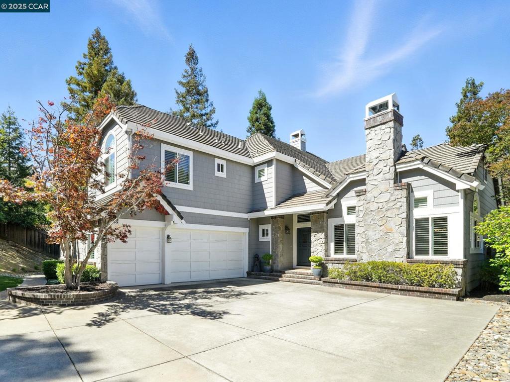 Updated Two Story in Eagle Peak at Oakhurst Country Club tucked away on a premium lot! Desirable downstairs En-Suite features spacious closet w/ mirror doors & updated bathroom offering an oversized stall shower w/ floor to ceiling surround & dresser style vanity w/ slab counter. Gorgeous gourmet kitchen boasts hw floors, slab granite counters w/ full backsplash & large center island, newer stainless steel appliances, an abundance of cherry cabinets, big pantry & casual dining area. Spacious family room offers a brick fireplace w/ raised hearth & mantle + bar. Elegant formal dining room features "Tuscan" columns & dramatic lighting & opens to living room w/ soaring ceiling highlighted by a beautiful floor to ceiling stacked stone fireplace. Spacious upstairs bedrooms & gorgeous updated bath offering a shower/tub w/ custom tile surround w/ stone accent details & dresser style vanity w/ slab counters & dual sinks. Double doors open to retreat style oversized primary suite w/ vaulted ceiling, seating area & 2-way fireplace shared w/ spa style primary bath boasting extensive stone tile floors, stall shower, freestanding soaking tub, vanity w/ dual sinks & make up area + walk-in closet. Fantastic flag lot offers extensive paver patio area, lush lawn & mature shade trees. Must see!!!