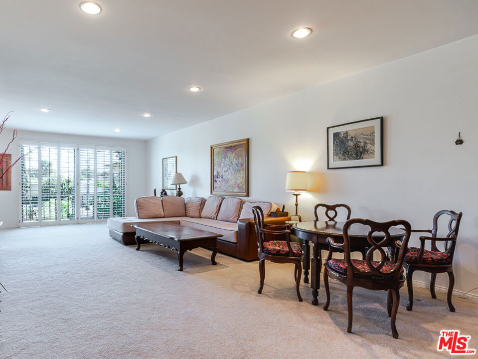 Maybe the largest 1 bedroom you you've ever seen, so large it has 2 bathrooms. Landing at an expansive 1780 sf this high ceiling and light filled condo feels more like a townhome, with 2 separate outdoor decks. Through the front doors you have a large formal entry way that frames the floor to ceiling shuttered windows with an open concept living and dining areas including custom built ins. Nice open kitchen with sliding doors to access its 2nd patio. Large bedroom with sizable walk in closet and primary bathroom with shower and spa tub. Washer + Dryer in unit. Monthly HOA includes earthquake insurance, community offers a pool and spa, 2 parking spaces included. Located in a quiet tree lined cul-de-sac with close access to shops, restaurants and freeway access.