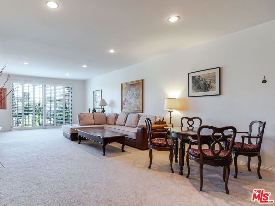 Maybe the largest 1 bedroom you you've ever seen, so large it has 2 bathrooms. Landing at an expansive 1780 sf this high ceiling  and light filled condo feels more like a townhome, with 2 separate outdoor decks. Through the front doors you have a large formal entry way that frames the floor to ceiling shuttered windows with an open concept living and dining areas including custom built ins. Nice open kitchen with sliding doors to access its 2nd patio. Large bedroom with sizable walk in closet and primary bathroom with shower and spa tub. Washer + Dryer in unit. Monthly HOA includes earthquake insurance, community offers a pool and spa, 2 parking spaces included. Located in a quiet tree lined  cul-de-sac with close access to shops, restaurants and freeway access.
