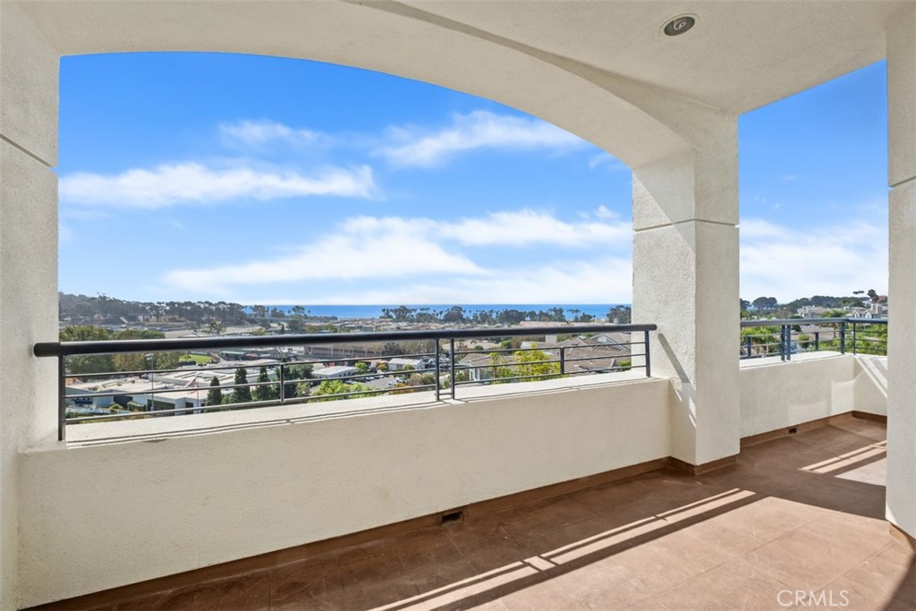 Welcome to Sea Bluffs, Dana Point’s premier 62+ full-service retirement community, where opportunities like this are truly rare. This elegant 2-bedroom, 2-bath residence offers both convenience and accessibility while showcasing sweeping white-water ocean views of Doheny Beach - that are simply extraordinary. The expansive living and dining areas feature high ceilings and abundant natural light, creating a sense of refinement and space. From your covered private patio, savor morning coffee or evening sunsets while watching the waves crash at Doheny Beach—an everyday luxury few can claim. The primary suite is graced with the same spectacular white-water views, along with dual closets and a private en-suite bath, while the second bedroom provides an inviting retreat for guests or a spacious home office. A well-appointed kitchen with breakfast nook and the convenience of in-unit laundry complete this remarkable home. Life at Sea Bluffs is designed to be effortless and elevated. Residents enjoy chef-prepared dining with daily breakfast plus 20 additional meals per month, weekly housekeeping, chauffeured transportation within seven miles, and the assurance of complete maintenance and utilities. Every detail, from HVAC and plumbing to appliances, is meticulously cared for—allowing you to embrace a lifestyle of comfort and leisure. The community itself offers the atmosphere of a private club, with amenities that include a grand clubhouse, library, multipurpose rooms, billiards, spa, fitness center, card room, and more. An engaging calendar of social programs, cultural classes, and curated activities keeps you connected, while just down the street the newly reimagined Dana Point Harbor invites you to indulge in world-class dining, boutique shopping, and coastal recreation. Monthly service fee: $5,447. Second-person fee: $2,100 (if applicable). HOA: $670 per month.