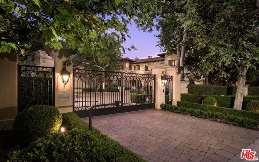 Set behind the prestigious Bel-Air guard-gated community of Moraga Estates rests this opulent Classic Italian Villa commanding nearly four acres on a rare double lot. With over 14,000 square feet comprising of four bedrooms and nine bathrooms, this villa boasts soaring ceilings, grand scale-sized rooms and a floor plan that is formal, yet creates a comfortable and inviting ambiance. Stunning architectural features throughout include sophisticated finishes, classical detail & elegant curved archways/windows that give way to the magnificent manicured gardens and sprawling lush grounds. Other luxurious amenities include: formal living and dining rooms, stately office/library with fireplace & walk-in bar, large master suite with fireplace, motor court for ten cars, swimming pool and a one bedroom two bath guest house, Crestron sound plus AV and tranquil outdoor lounging spaces.