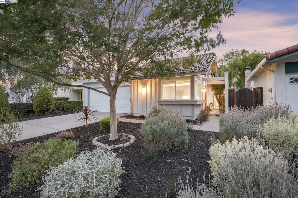 Beautifully updated single-story home in desirable Northgate offers 1,450 sq ft of light-filled living space with 3 bedrooms and 2 baths. This exceptional floor plan features vaulted ceilings in the living room and an inviting open-concept kitchen and family room combo. The kitchen is equipped with new stainless steel appliances and granite slab counters. Freshly painted inside and out, the home also boasts newly installed luxury vinyl plank tiles in the family room and kitchen, new carpet in the bedrooms, and updated baths with new LVP flooring. A peaceful front atrium welcomes you in, while brand new landscaping in the front and back creates excellent curb appeal. Additional upgrades include a new garage door. The spacious primary suite offers generous closet space and overlooks the low-maintenance backyard with a patio and pergola—ideal for relaxing or entertaining. Conveniently located within walking distance to top-rated schools, scenic trails, shopping, and more!