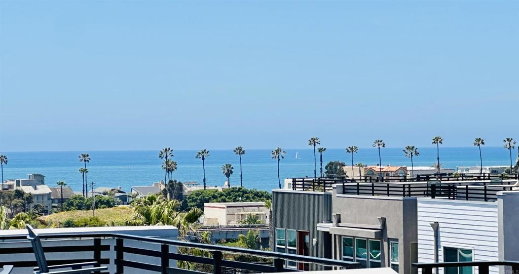 Incredible OCEAN VIEWS and a Private ROOFTOP DECK - RARE 5Bed/4Ba end unit, 2,556 sq ft. 2 Car Garage with LARGE private expansive rooftop deck with SUNSET views. 2018 construction, located in highly sought-after Vista Del Mar community off Pacific Coast Hwy, just a short 5 min walk to BEACH on Oceanside/Carlsbad border. Beautifully decorated, Meticulously upgraded Tri-Level Townhome... Open concept Kitchen/Family room features shiplap, beamed ceilings, custom lighting, upgraded cabinetry, quartz counters with waterfall edge island, stainless appliances, large breakfast bar & eat-in nook, custom window coverings & woodworking with upgraded flooring throughout. Multi-level outdoor deck space, French doors. Professionally decorated and seller will consider Option to purchase completely furnished. 1st Floor: One Bedroom & Bath, living room/office/exercise area, garage access - 2nd floor: Kitchen/Family room, Guest Bedroom & Bath, coffee bar - 3rd floor: Primary Bedroom & Bath, 2 secondary Bedrooms & Bath with laundry. 4th level: roof top deck. The super sized Primary Bedroom has a gorgeous bath: Tile flooring, lighting, large walk-in shower, a double vanity and quartz countertops dual sinks & huge walk-in closet with access to rooftop deck. Private Association amenities include a resort-like Swimming Pool/Spa/BBQ area. Quiet location, property is conveniently located next to Oceanside/Carlsbad beaches, restaurants, grocery stores & major freeways 5/78/76. A short bike ride to the Carlsbad Village or Downtown Oceanside restaurants, cafes, shopping, and the train station. You MUST SEE this home. Don’t miss this opportunity to own a newly constructed and upgraded home in an exceptional coastal location.