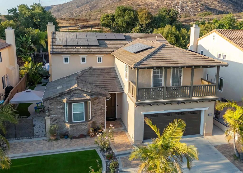 Located in the San Miguel Ranch community, this home offers an elevated views of San Diego, Mexico, and ocean sunsets toward Point Loma and the South Bay coastline from the front balcony. The property is adjacent to a national wildlife refuge and nearby hiking trails. The kitchen is updated with black quartz countertops, a full backsplash, farmhouse-style sink, gas range, and stainless steel updated appliances. Additional features include a Tesla battery for solar power storage, energy-efficient tankless water heater, EV charger, Solar Panels and whole-home water softener. Upgrades include a new dishwasher, washer, dryer, turf landscaping, and a sauna. The floor plan includes 4 bedrooms (1 downstairs, 3 upstairs), 1 loft & 1 additional room created from a partial garage conversion located downstairs that includes a sauna. Three upstairs bedrooms each include a custom-built walk-in closet. The downstairs includes a bedroom adjacent to a full bathroom.