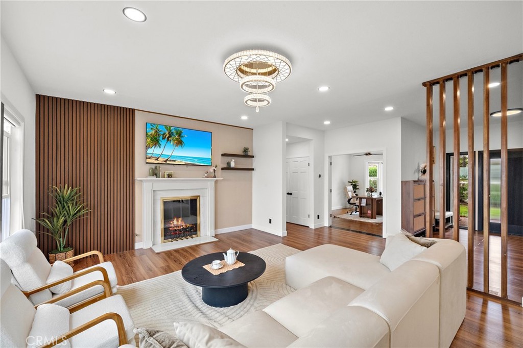 Discover the pinnacle of hillside luxury in this fully reimagined 4-bedroom, 4-bath estate—3,669 sq ft of sleek, modern design set atop a private 1.78-acre knoll in the guard-gated Diamond Bar Country Estates. From the moment you arrive, you’re greeted by sweeping canyon-to-city-light panoramas that flow through walls of window's glass and expansive ceilings, bathing every room in warm, natural light.
At the heart of the home, the chef’s kitchen shines with a dramatic waterfall-edge quartz island, premium appliances, custom European-style cabinetry, and polished hardware—perfect for both everyday meals and grand entertaining. Each spa-inspired bathroom is a sanctuary, boasting floating vanities, floor-to-ceiling tile, frameless rain-head showers, deep soaking tubs, and sleek bidet-equipped toilets.
The versatile three-story floor plan features a main-level guest suite with private deck access, an upstairs loft/media room framed by glass railings, and a tucked-away fitness nook overlooking mature oaks. Step outside to an entertainer’s dream: multiple wraparound decks and covered verandas, a built-in barbecue with prep station, glowing fire pit, and terraced gardens—all designed for sunset cocktails, morning coffee, or starlit gatherings.
Enjoy the perfect blend of tranquility and convenience—just minutes from top-rated schools, scenic hiking and biking trails, premier shopping, and fine dining. This is not just a home; it’s a lifestyle destination with the most breathtaking views in Diamond Bar.
