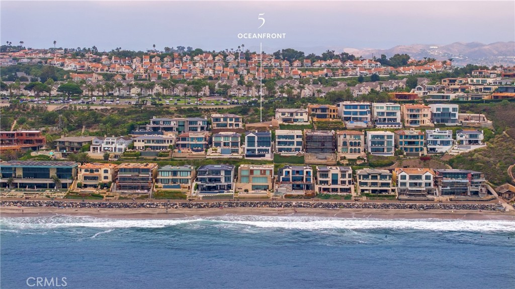 The Strand at Headlands – Final Opportunity to Build Your Dream Home.
This is your chance to secure the last available homesite in the coveted guard-gated community of The Strand at Headlands. Spanning approximately 9,047 square feet and boasting about 71 feet of mesmerizing ocean-view frontage just 459 feet from the sand, this rare parcel offers unobstructed, sweeping vistas—from the dramatic Headlands to Catalina Island and stretching north as far as the eye can see.
Positioned to capture some of Southern California’s most breathtaking sunsets, this build-ready lot is your blank canvas to create a coastal masterpiece worthy of its world-class setting.
Residents of The Strand enjoy an extraordinary lifestyle with world-class amenities, including a private oceanfront clubhouse with lounge, state-of-the-art fitness center, and a recently revitalized pool and spa overlooking the Pacific. The community’s offerings extend to a pristine half-mile stretch of Strand Beach, scenic Headlands walking trails, the picturesque Dana Point Harbor, a 9,000 sq. ft. private Beach Club, and 24-hour guarded security.
Just moments from the Ritz-Carlton, Monarch Beach Resort, The Montage, and premier shopping, dining, and beaches, this exceptional property combines rarity, beauty, and location into one unparalleled offering.