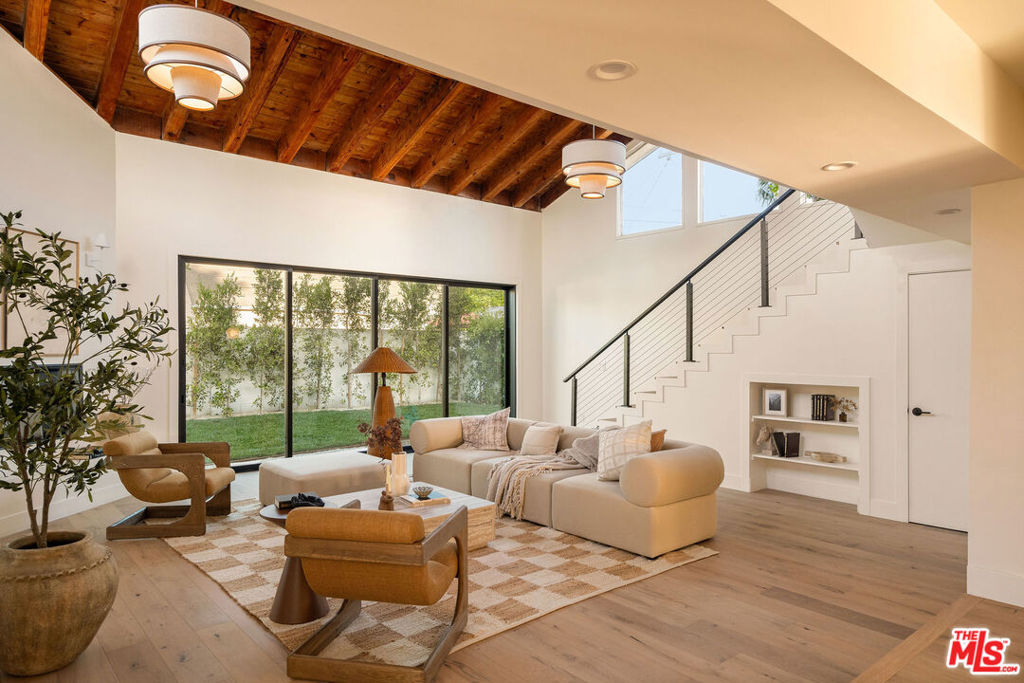 Ease into ownership with a lower monthly payment via seller paid interest for the first two years! The seller is offering a 2-1 interest rate buy down to an acceptable offer, valued at $40,000 and lowering your monthly payment by around $3,000/month the first year of your mortgage and $1,500/month the second year, at the seller's expense!*. Intentionally designed architectural dwelling in Baldwin Vista! Step through a solid set of Pinky's Iron Doors and into a bold, beautifully reimagined two-story residence where high end design and everyday comfort collide in all the right ways. This architectural gem is packed with soul, light, and curated finishes that make everyday living feel like an editorial shoot. On the main level, two spacious bedrooms are joined by a stylish Jack-and-Jill bathroom featuring Ceppo marble countertops and backsplash, dual vanity, a shower/tub combo, and custom lighting. A separate powder room with matching stone adds a chic touch for guests. The formal living room sets the tone with warmth and character, as light beams in through a large picture window. Take a seat on the custom bench and soak up the incoming rays. New engineered hardwood floors flow effortlessly into the dining area and then to the dream kitchen a true centerpiece of the home. Wrapped in Verde Alpi green marble with custom white oak cabinetry, an oversized island, Forno 8-burner range with griddle and double ovens, built-in microwave, double-drawer beverage fridge and water filtration, every inch is both functional and stunning. At the rear, a jaw-dropping family room with roaring 20-foot vaulted ceilings is bathed in natural light and framed by oversized aluminum sliders that blur the line between indoor and outdoor living. A third full bath off the family room is perfectly placed for backyard entertaining. Up the floating staircase, the primary suite is pure magic massive, 10 foot ceilings, sunlit, and serene. A fully built-out walk-in closet provides the ultimate in organization, while the primary bath is the stuff of dreams: an oversized soaking tub beneath a skylight, glass-enclosed walk-in shower, floating dual vanity, and private water closet all designed to restore and inspire. A bonus bedroom just off the suite is perfect for a nursery, home office, or creative studio. Behind the beauty: all-new plumbing, electrical, HVAC, energy-efficient windows, and a brand-new sewer line to the street. Outdoors, the vibe continues with a dining area for al fresco meals under the stars, irrigated landscaping for privacy and ease, and a 2-car garage ready for storage, projects, or your next big idea. This is Baldwin at it's most beautiful soulful, striking, and completely move-in ready. Welcome home! *Terms are subject to lender approval. Extension of credit offer is subject to acceptable offer at seller's discretion. Reach out for more info.